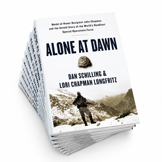 Stack of Alone at Dawn signed books by Dan Schilling about John Chapman and Takur Ghar