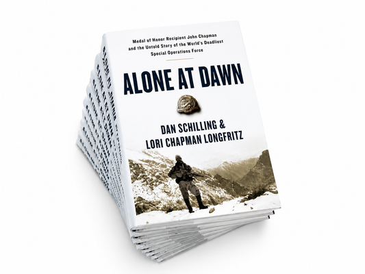 Stack of Alone at Dawn signed books by Dan Schilling about John Chapman and Takur Ghar