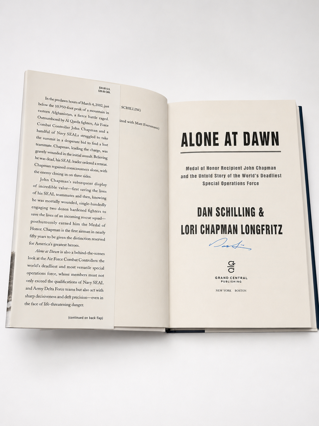 Open signed copy of Alone at Dawn by Dan Schilling and Lori Chapman Longfritz showing title page and signature