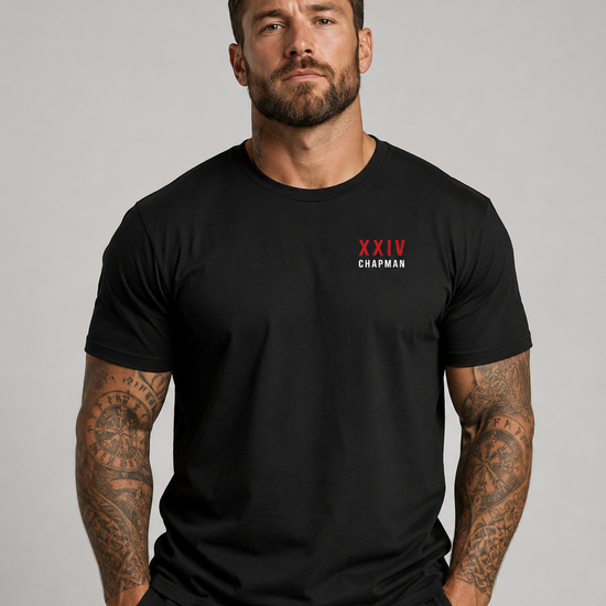 Male model wearing vintage black John Chapman Chappy Combat Controller shirt front view