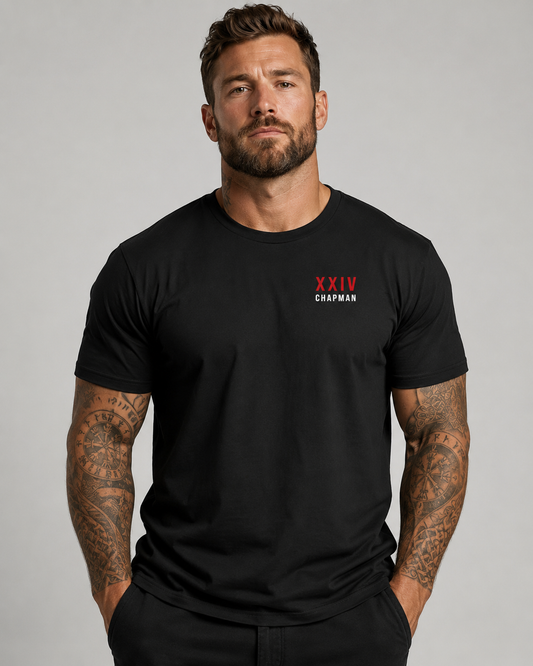Male model wearing vintage black John Chapman Chappy Combat Controller shirt front view